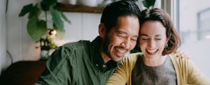 Cheerful couple planning their future home