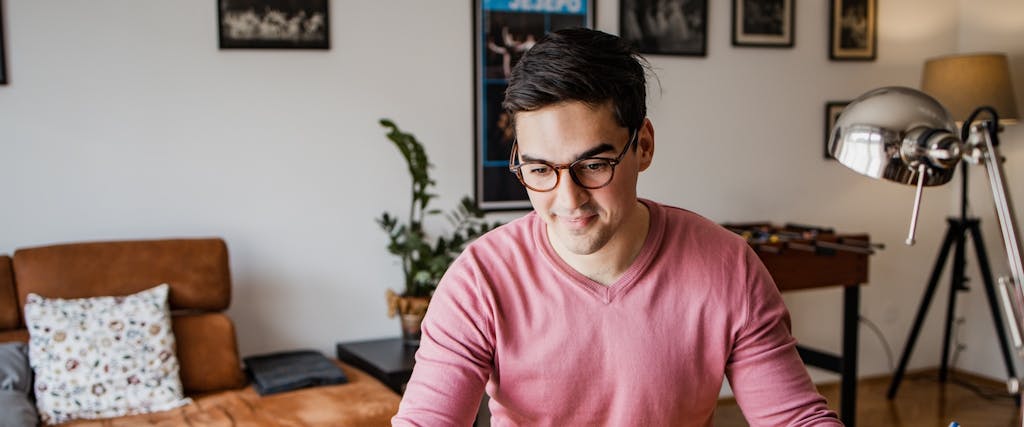 Young man is working on laptop