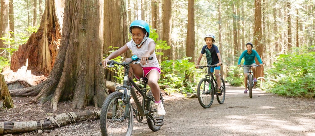 Family biking in the woods